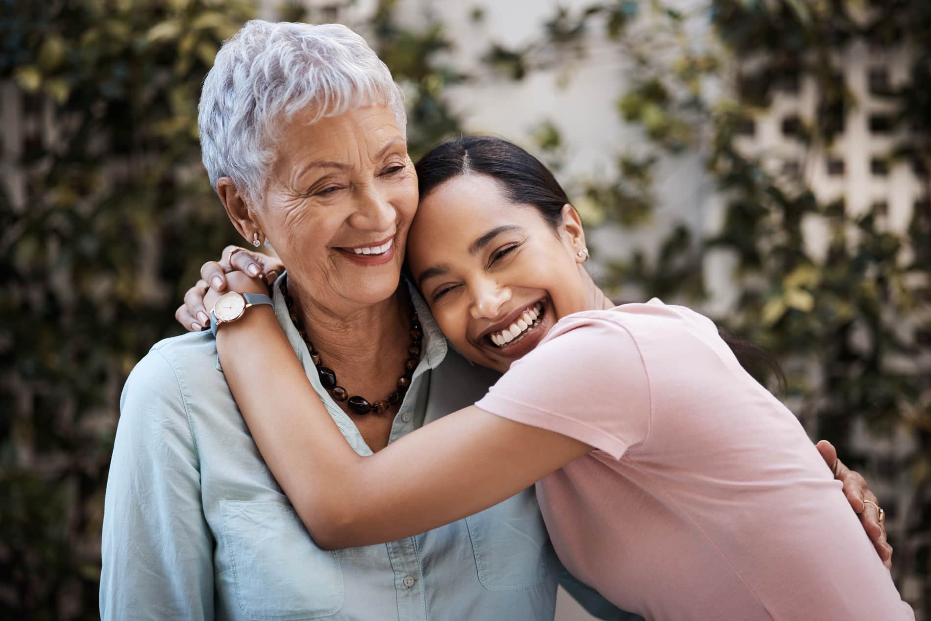 AdobeStock_605115846 v2 Woman hugging her granddaughter after get prosthodontic placement in Salt Lake City UT