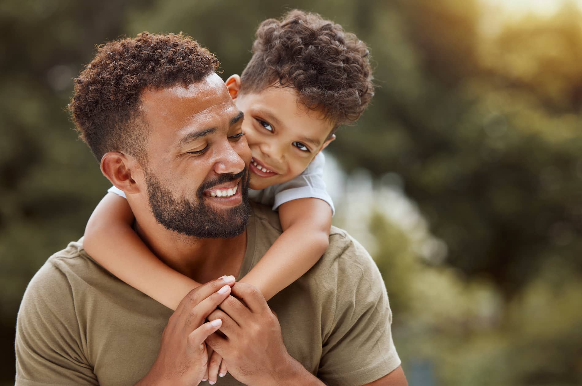 AdobeStock_1262484510 v2 Dad plays with his son happy with his fixed smile in after all on 4 in SLC UT