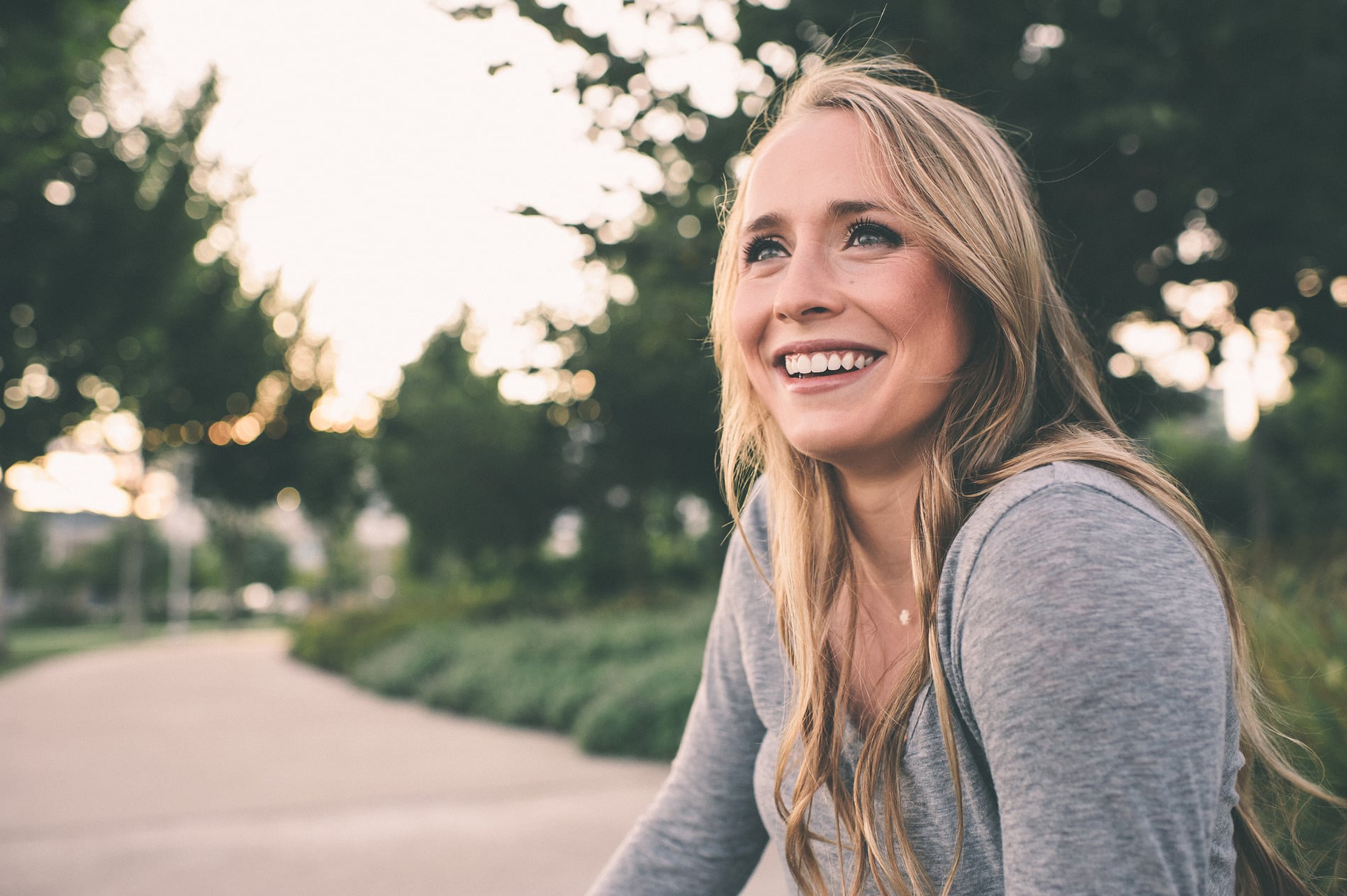AdobeStock_247629214 v2 Woman on her way to Renovo Prosthodontics for teeth in a day in Salt Lake City UT