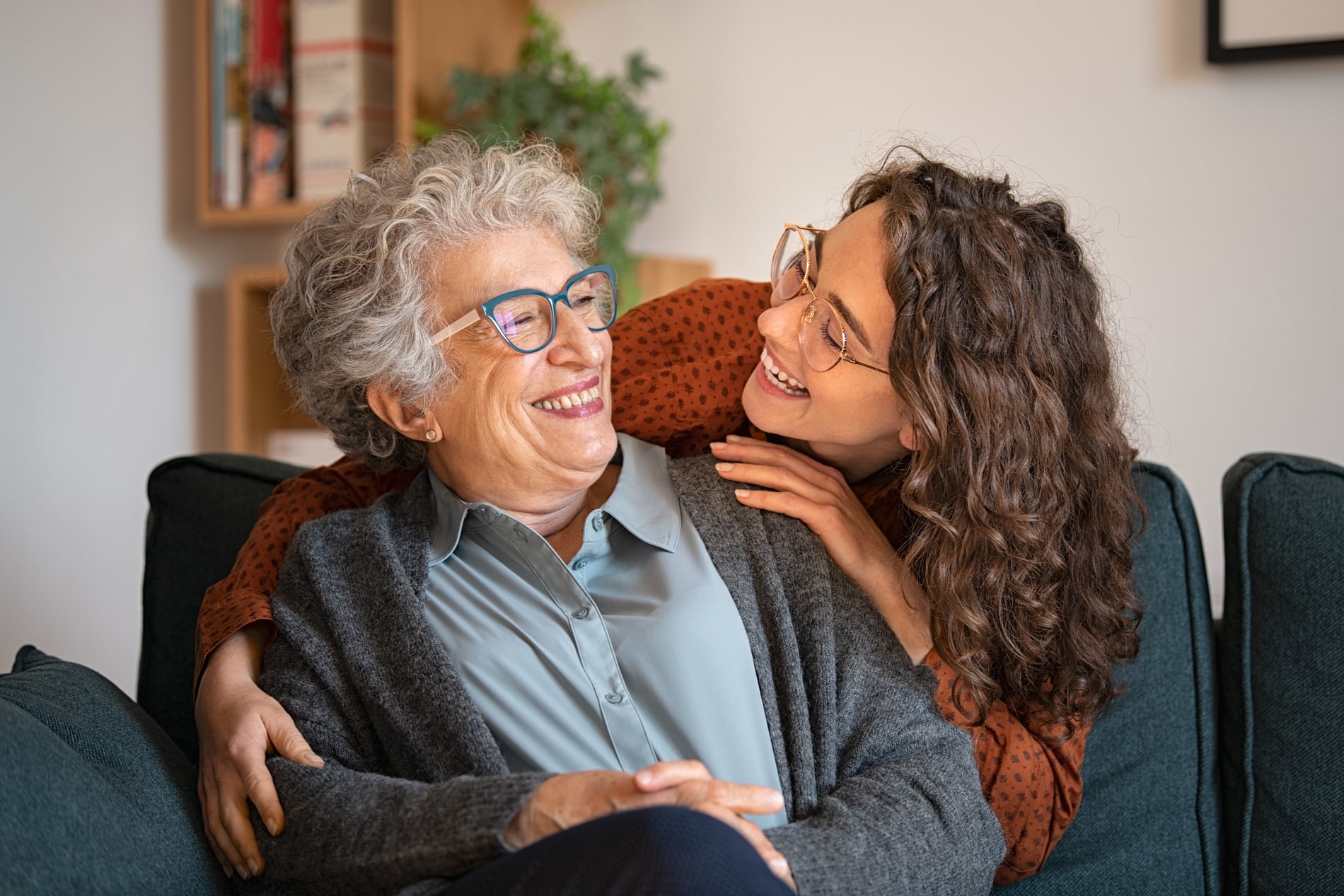 Mom and daughter laughing together on their way to a denture appointment in Salt Lake