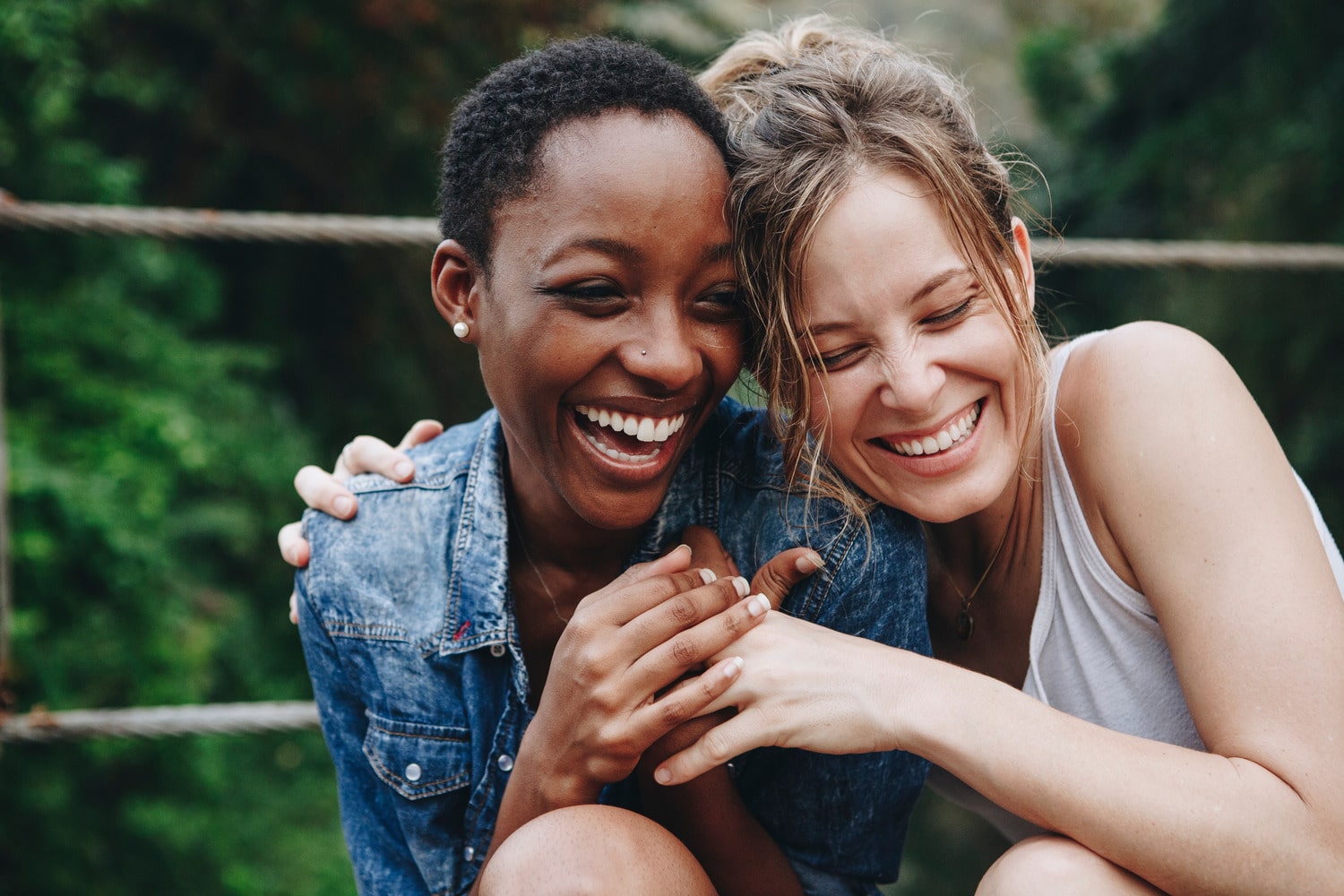Woman laughing with perfect teeth after prosthodontic treatment